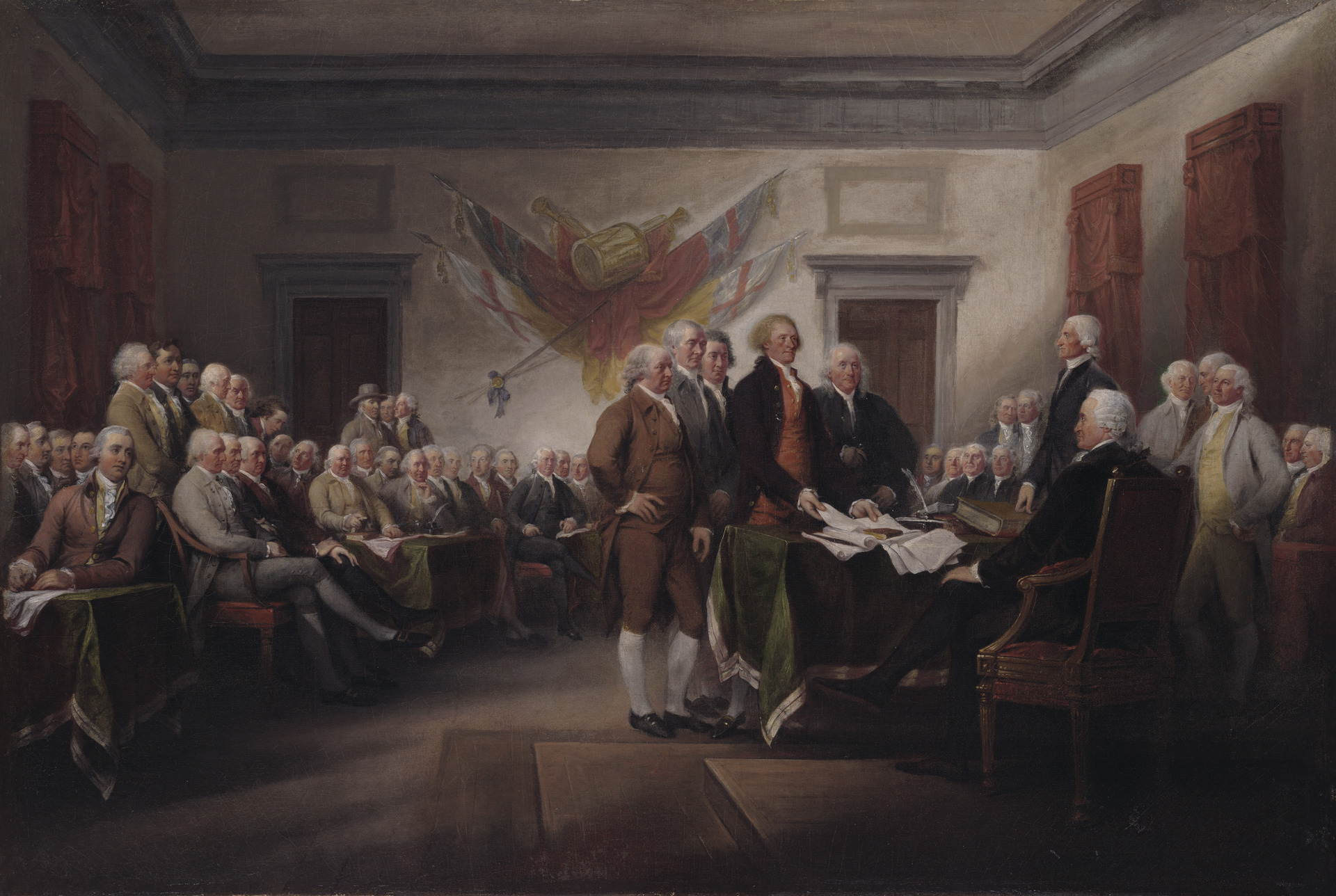 Five delegates present a document before a seated Congress in a high ceilinged assembly room.