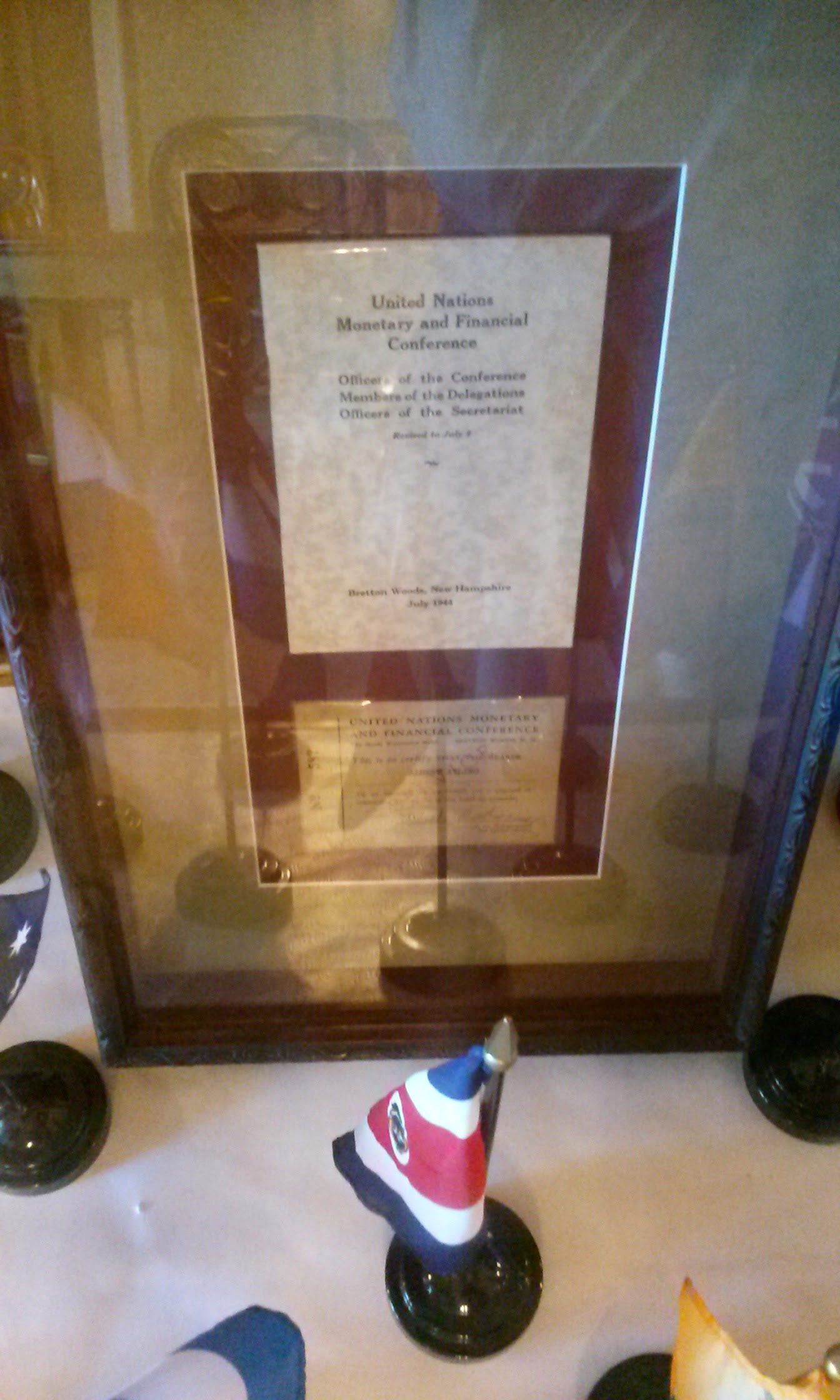 A conference program and delegate badge are displayed inside the Gold Room at the Mount Washington Hotel.