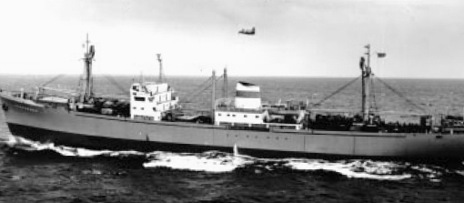 A Soviet cargo ship rides low in the water while being observed from the air during the missile crisis.