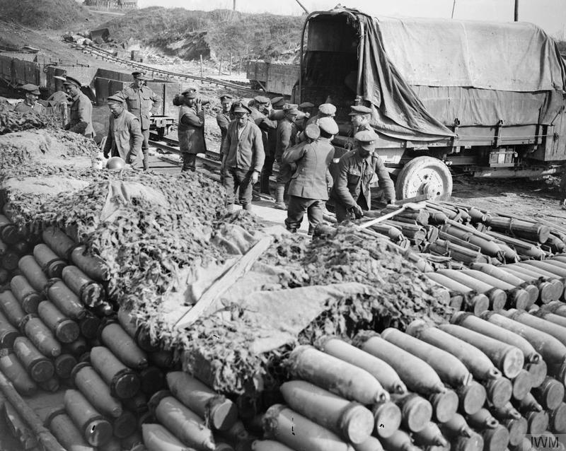Soldiers and military equipment occupy a battered roadside during the German Spring Offensive.