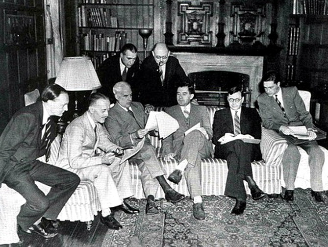 British, Soviet, and American delegates sit and stand together in a study during the Dumbarton Oaks talks.