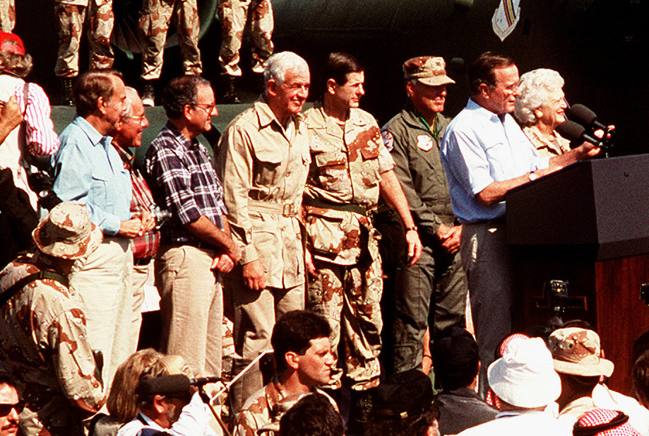 President George H. W. Bush speaks to assembled coalition personnel at an air base in Saudi Arabia.