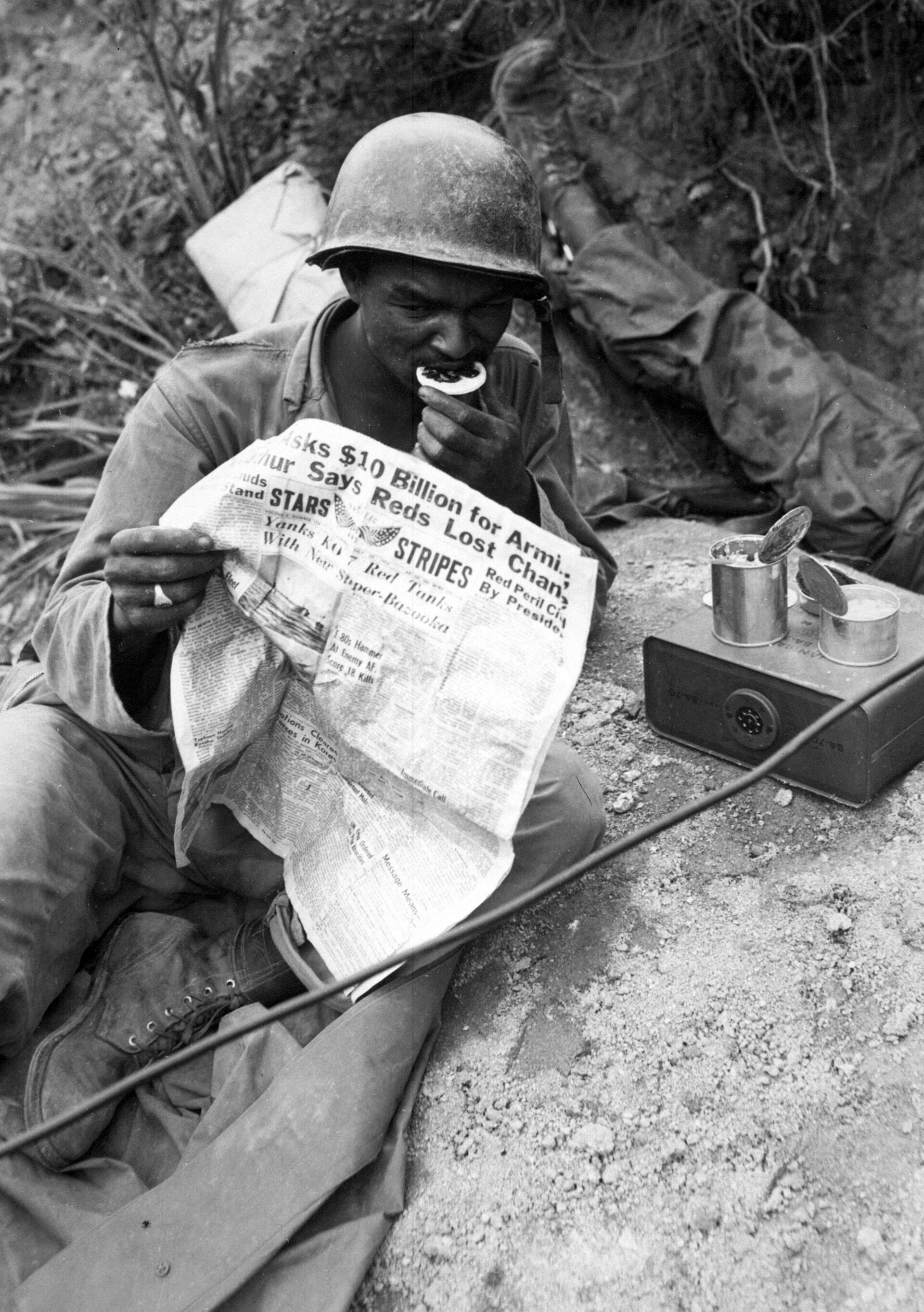 United States infantrymen move through rough terrain while defending the Pusan Perimeter.