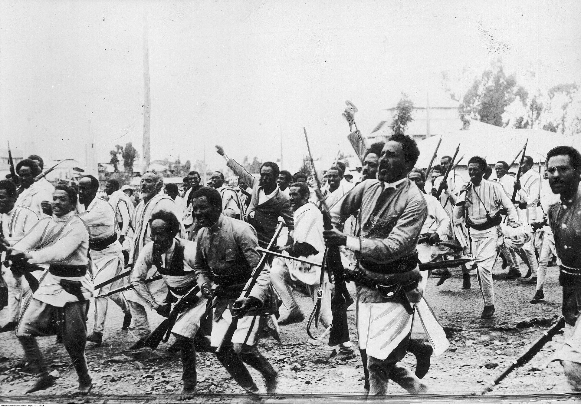 Armed Ethiopian men travel together toward the northern front during the Italian invasion.