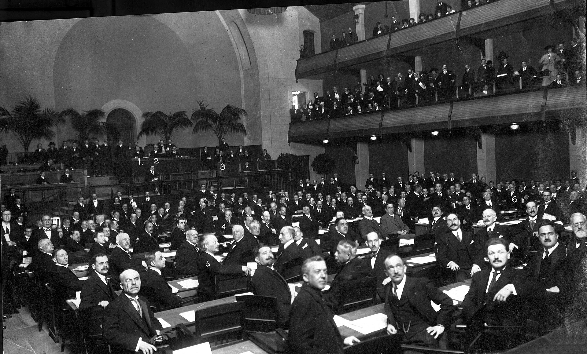 Delegates gather in a large hall for an early session of the League of Nations in Geneva.