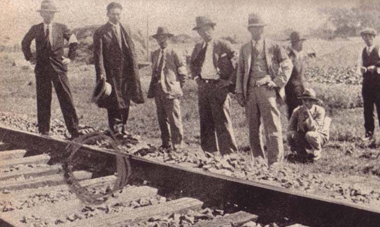 Japanese personnel inspect a damaged section of railway track near Mukden.