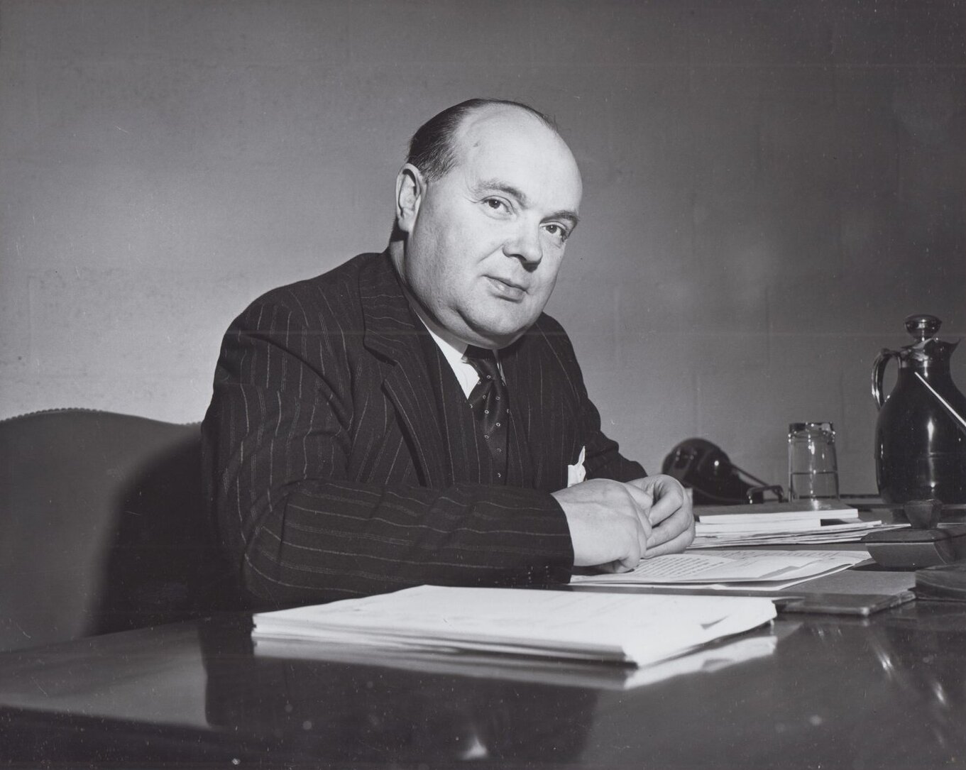 Paul-Henri Spaak, president of the United Nations General Assembly, sits at a desk in an official 1946 portrait.