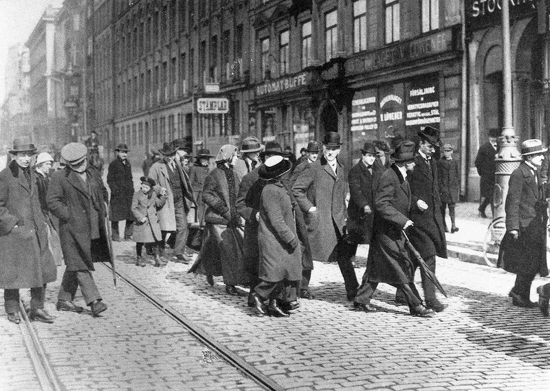 Vladimir Lenin walks with companions along a Stockholm street while traveling back to Russia in April 1917.