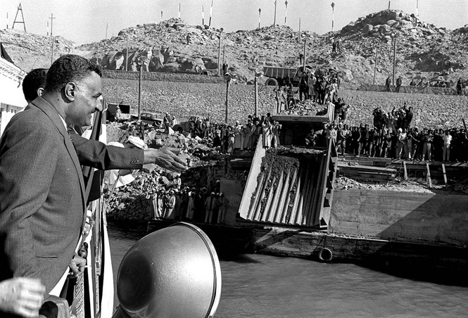 Egyptian president Gamal Abdel Nasser observes work beside the Nile at the Aswan High Dam construction site.