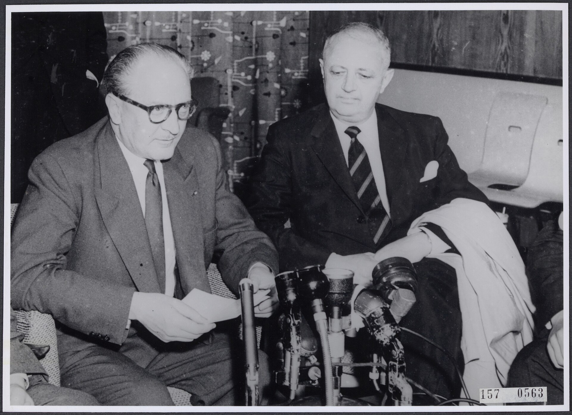 French prime minister Guy Mollet and foreign minister Christian Pineau sit together during talks in London about the Suez Canal.
