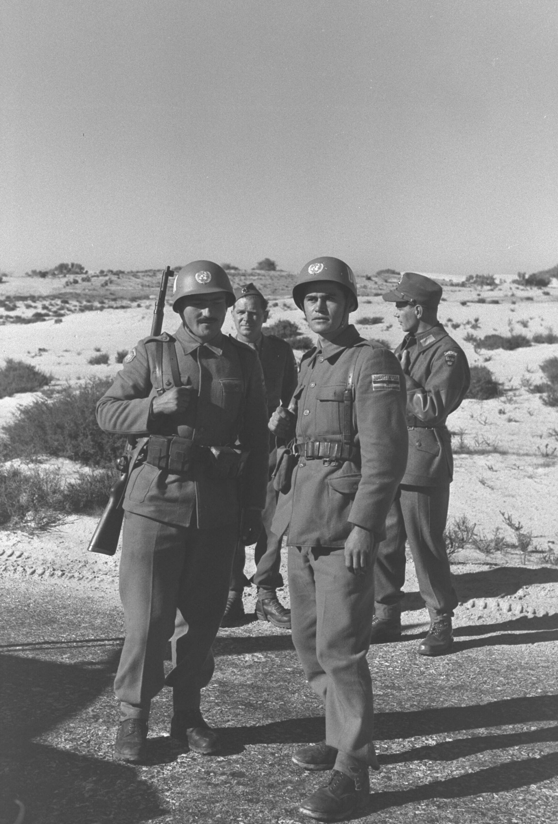 Yugoslav soldiers serving with the United Nations Emergency Force stand together in the Sinai desert in January 1957.