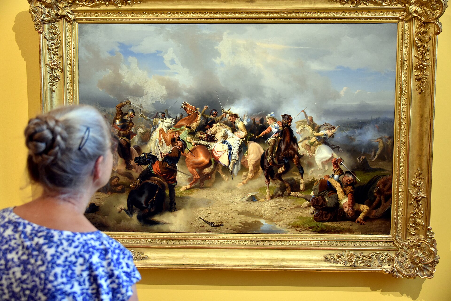 A king falls from his rearing horse amid cavalry and powder smoke.