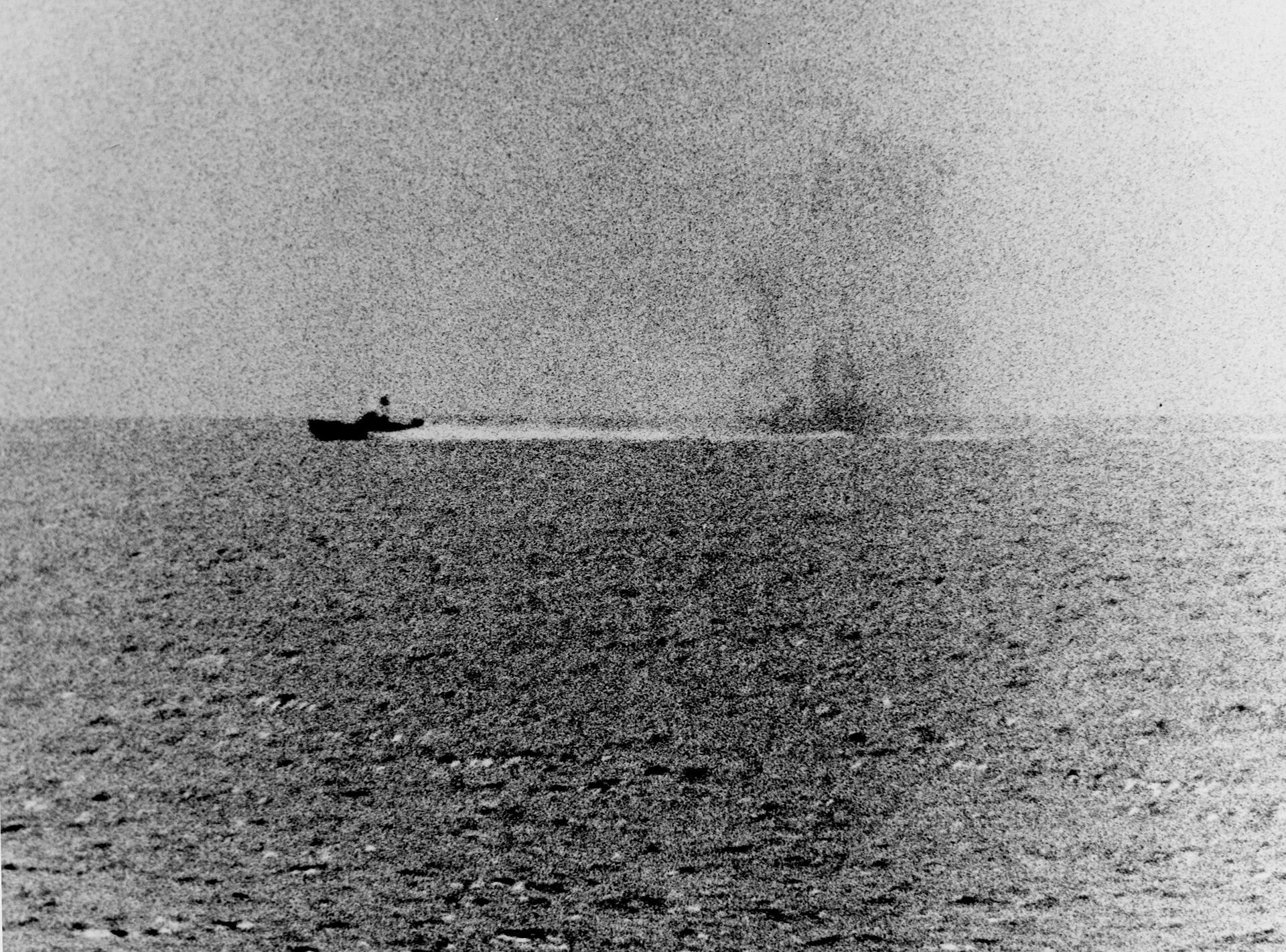 A North Vietnamese patrol boat maneuvers through the water while under fire from USS Maddox in the Gulf of Tonkin.